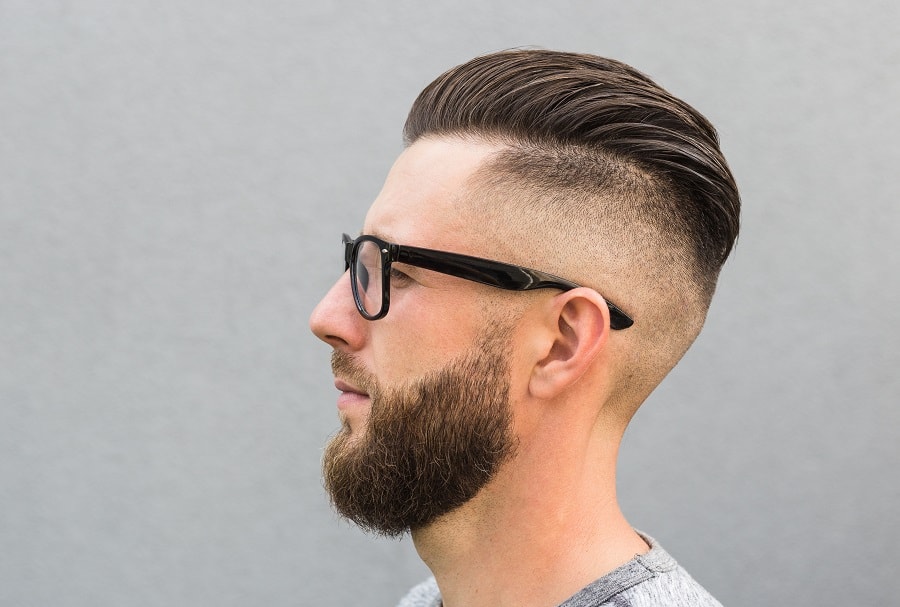 mens slicked back hairstyle with skin fade