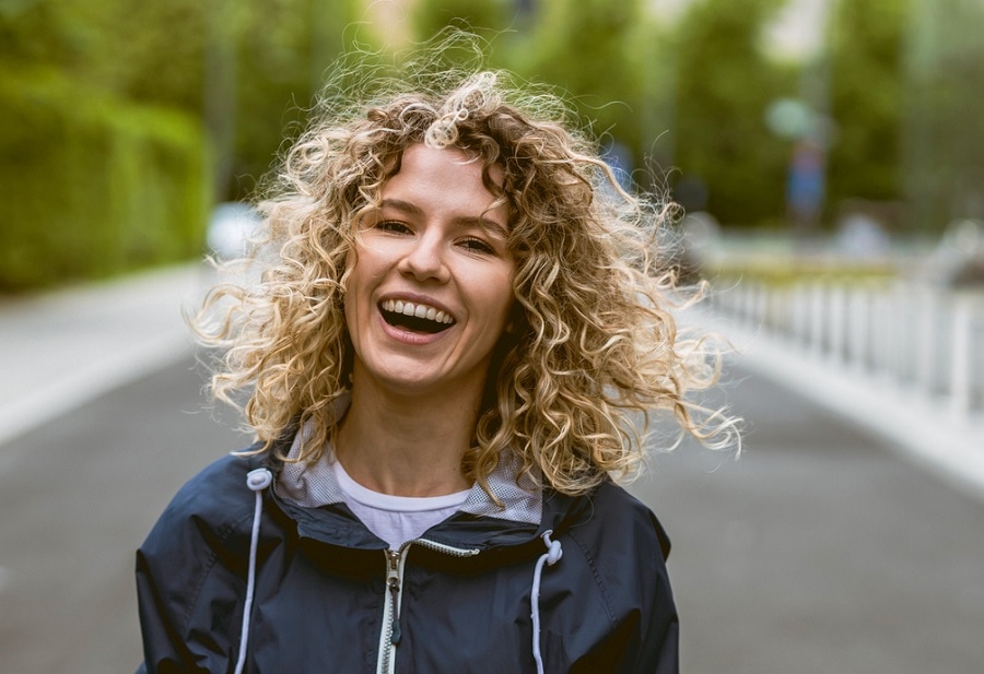 messy curly hairstyle for thin hair