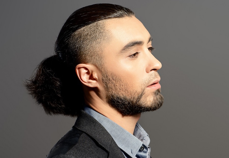 slicked back ponytail with undercut for men
