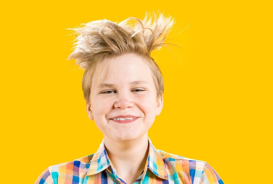 teen boy with long blonde spiky hairstyle