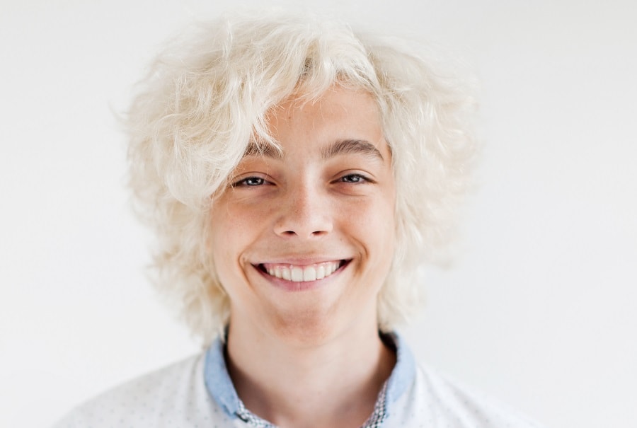 teenager guy with white blonde hair