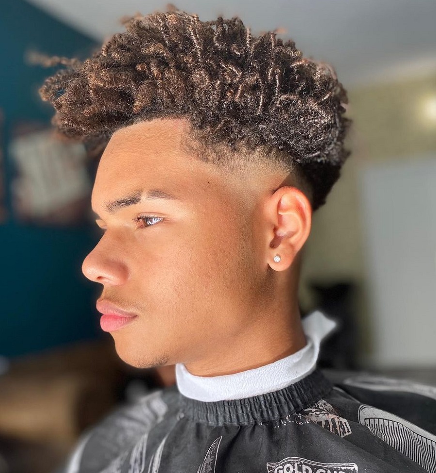 black guy curly fade with highlights