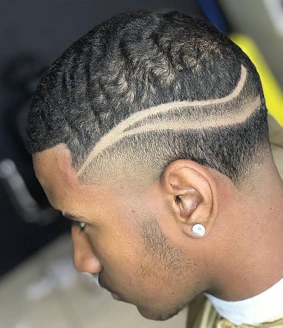 black men fade haircut with design