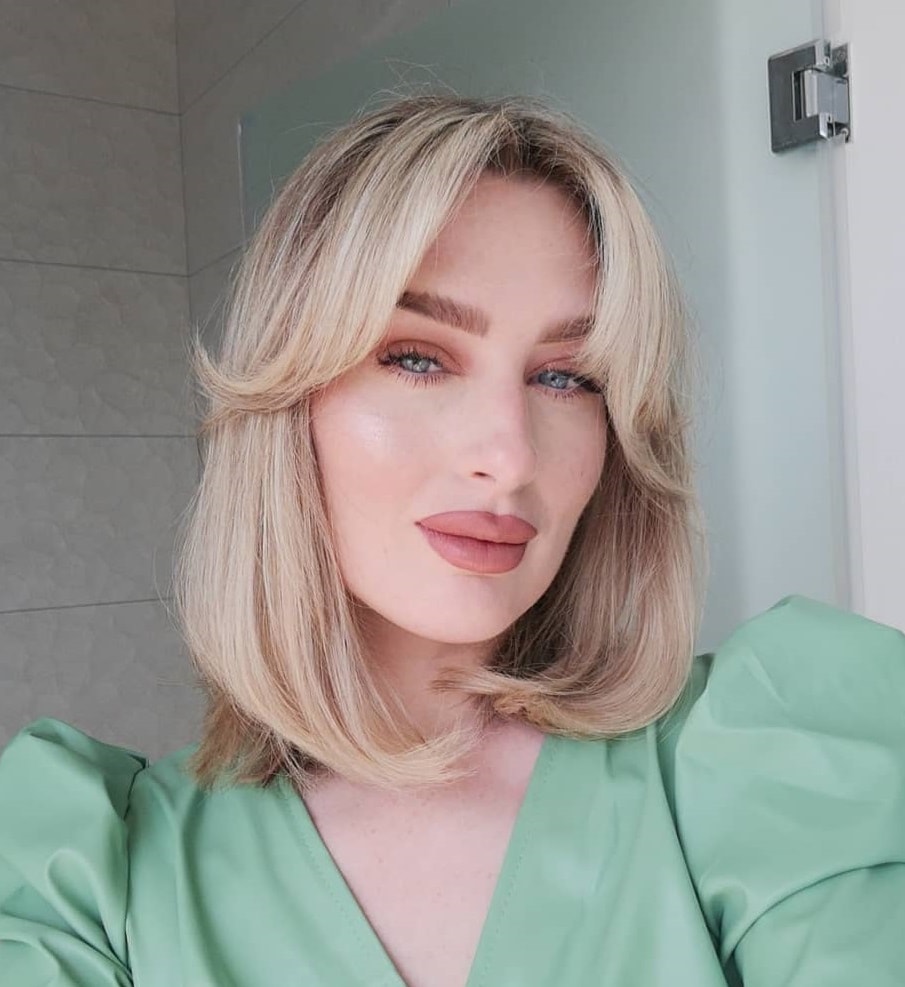 blonde bob with feathered bangs