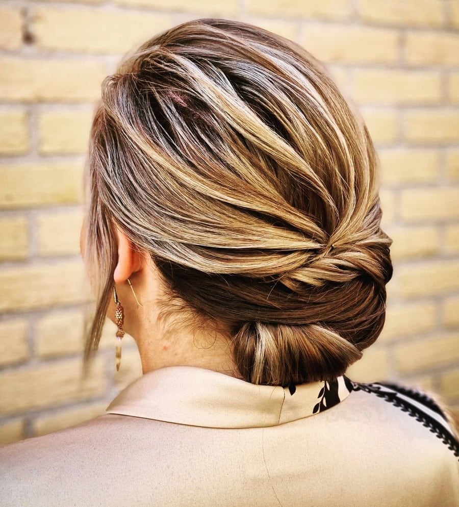 chignon bun with blonde highlights