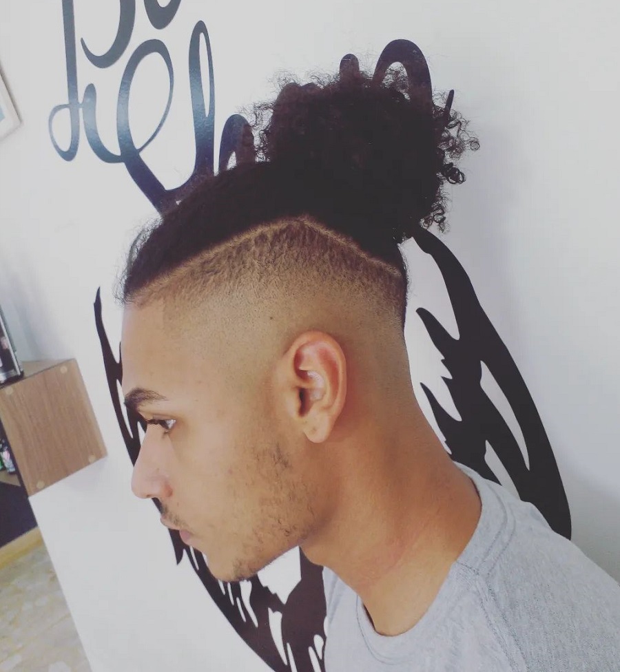 curly topknot with high fade for black men