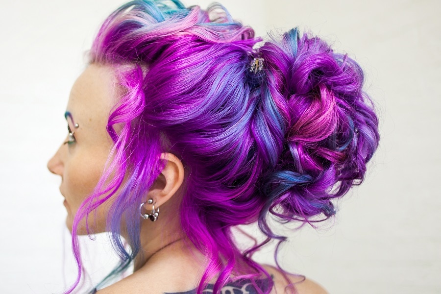 curly updo with purple balayage hair