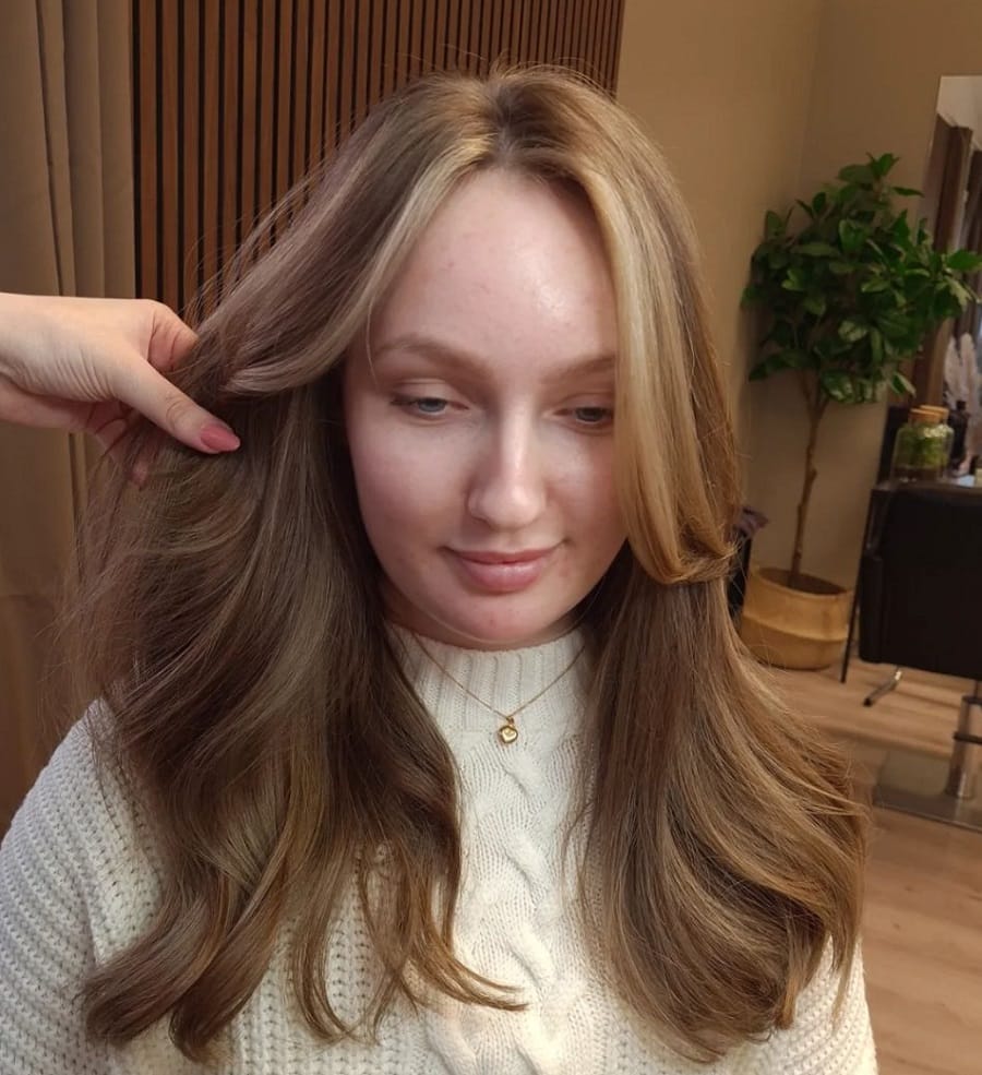 dark blonde hair with face framing highlights