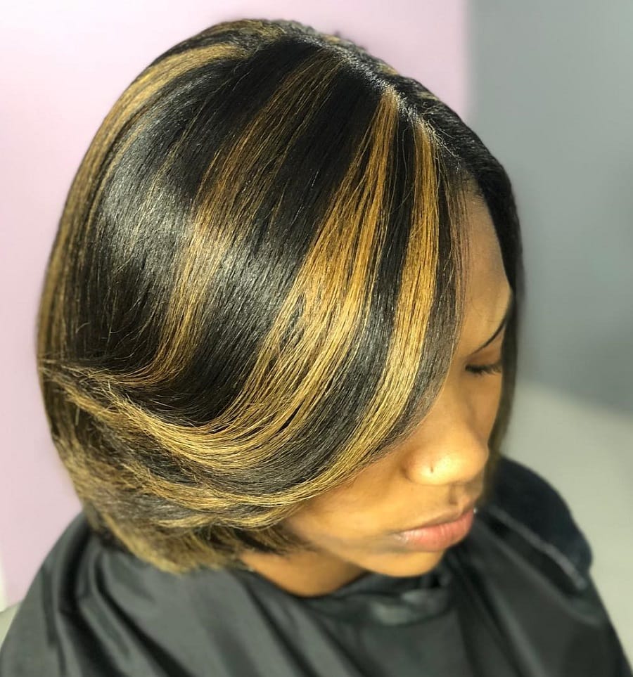 feathered bangs with blonde highlights