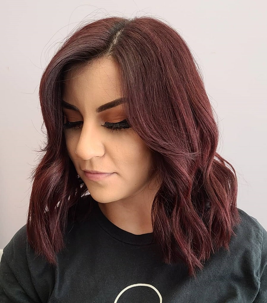 feathered bangs with dark red hair