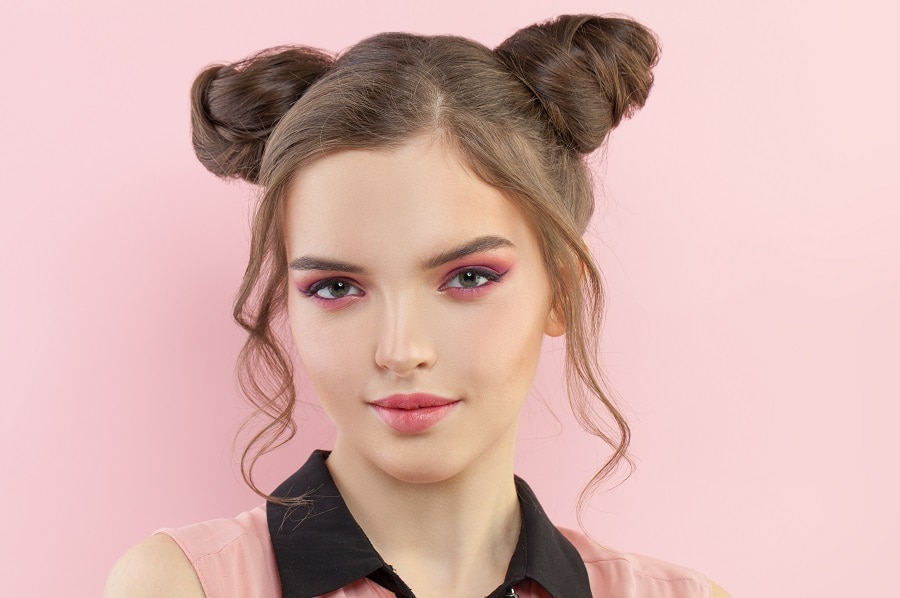 greasy hairstyle with space buns