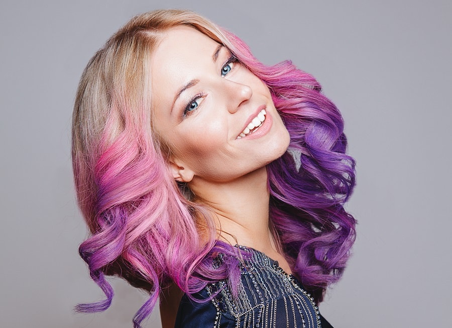 purple balayage on blonde curls