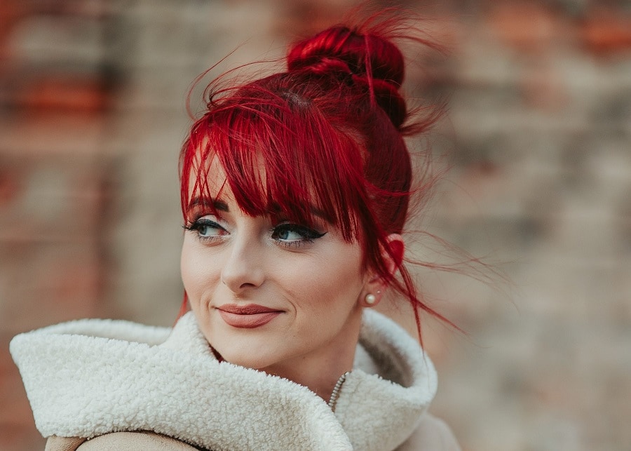 red hair updo with wispy bangs