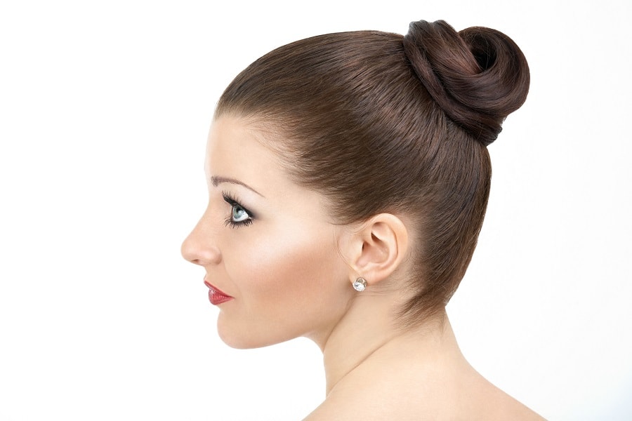 sleek bun hairstyle for wedding guest