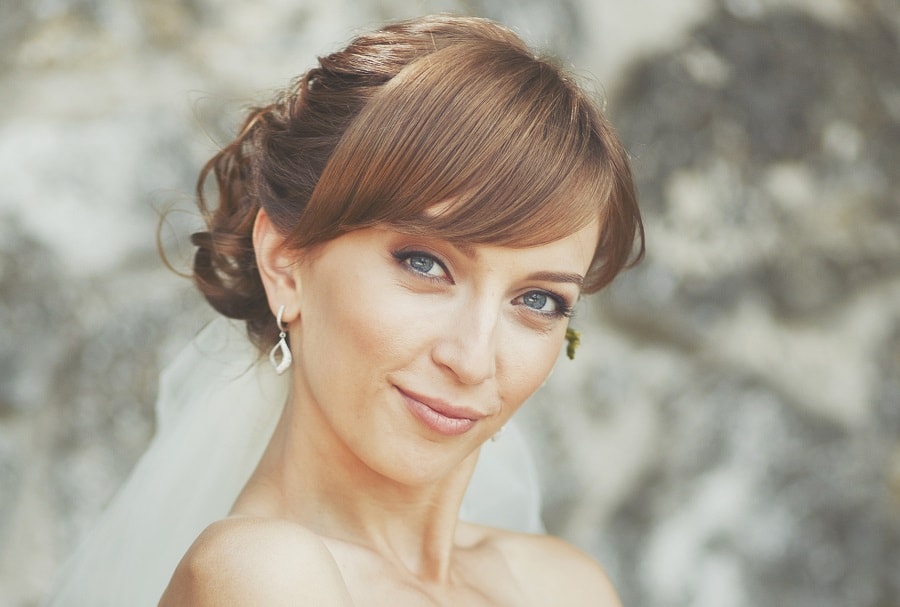 updo with bangs for beach wedding