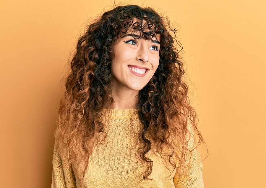 curly bangs with copper pintura highlights
