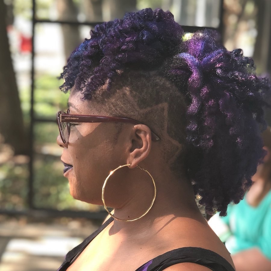 natural hair mohawk with purple highlights