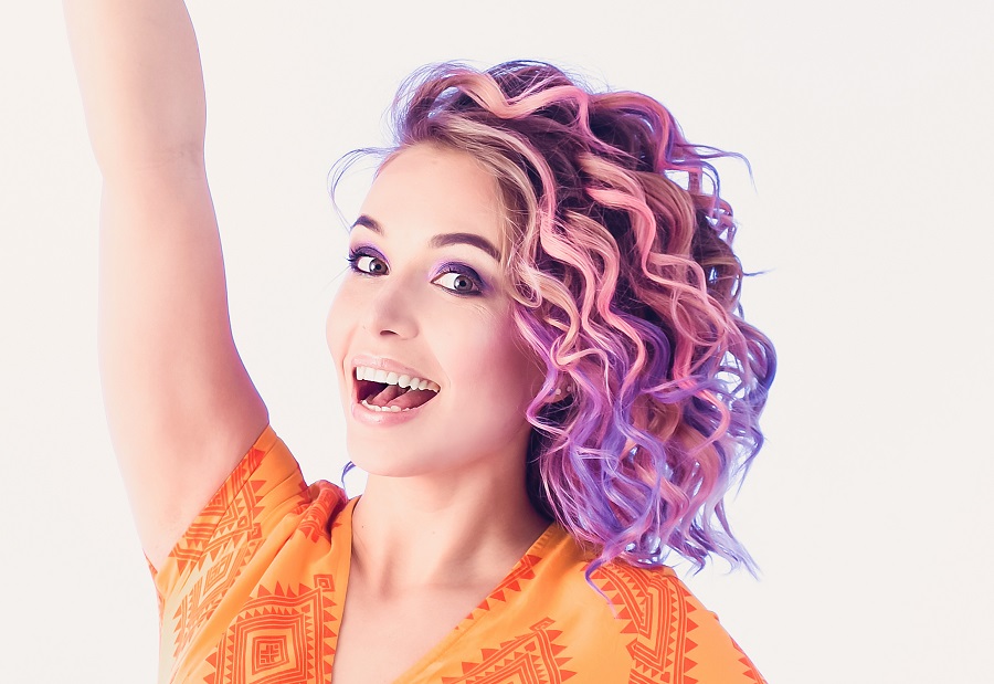 purple pintura highlights on curly hair
