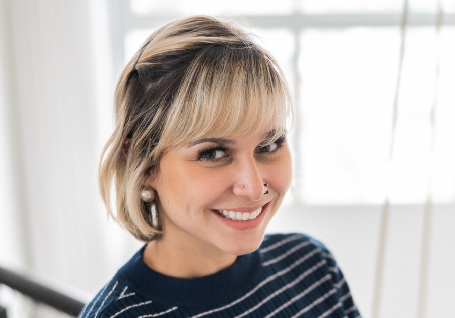 thin blonde bob with layered bangs