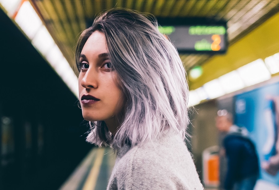 thin gray balayage hair with dark roots