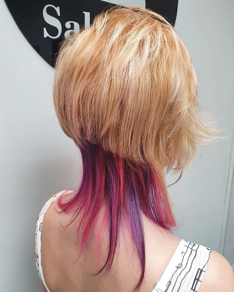 asymmetrical haircut with pink highlights