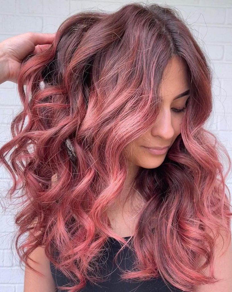 layered hair with pink highlights
