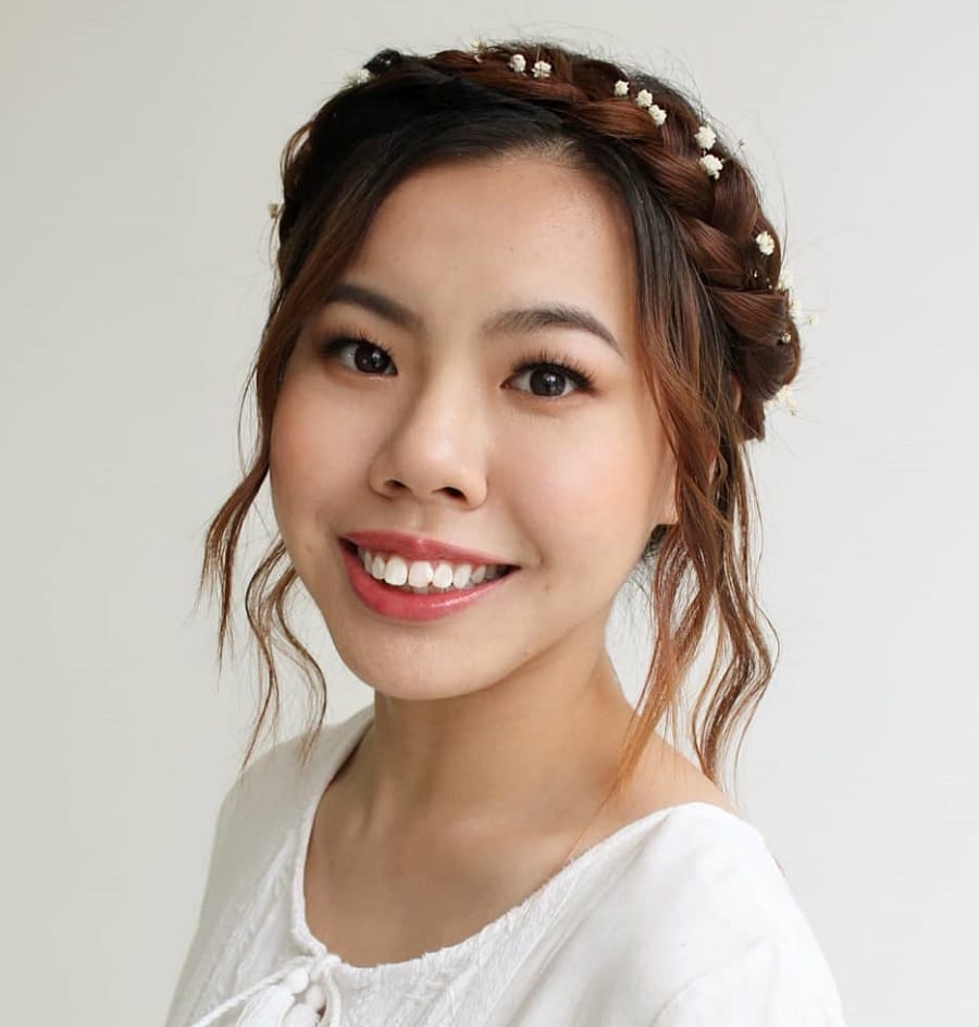 Asian woman with milkmaid braid