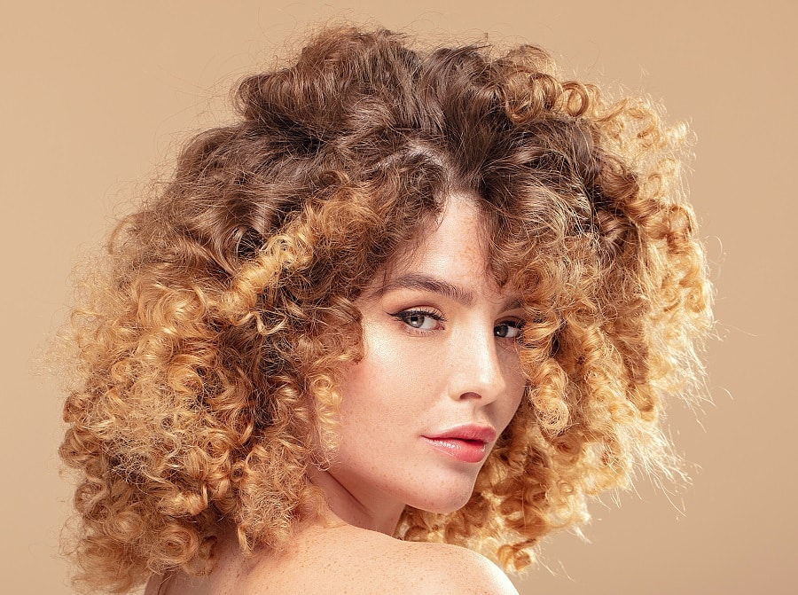 curly honey balayage hair