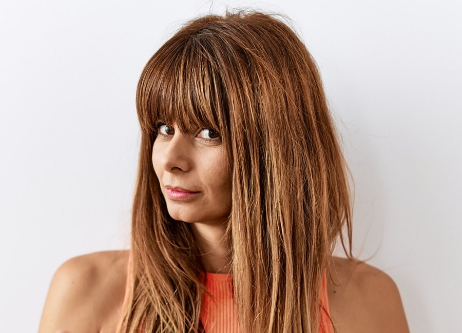 long layered haircut with blunt bangs