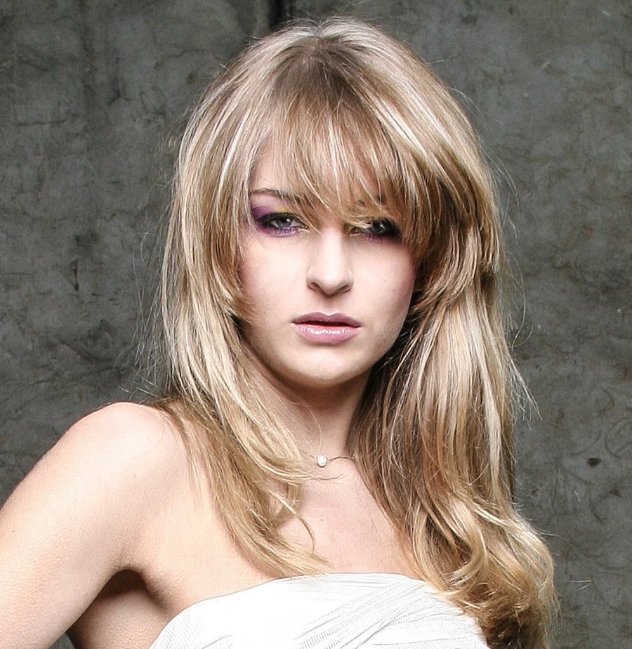 long layered haircut with thick bangs