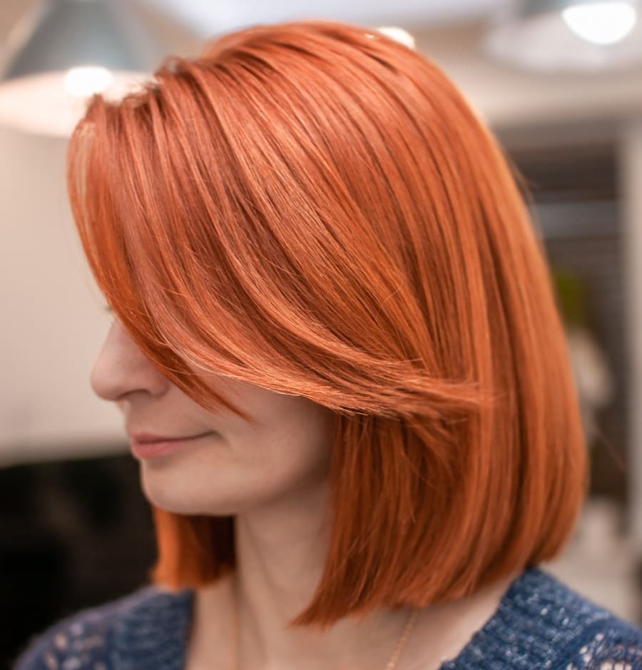 red bob with curtain bangs