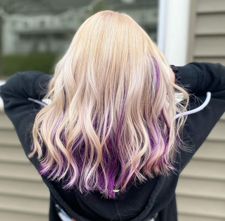 blonde hair with dark purple underneath