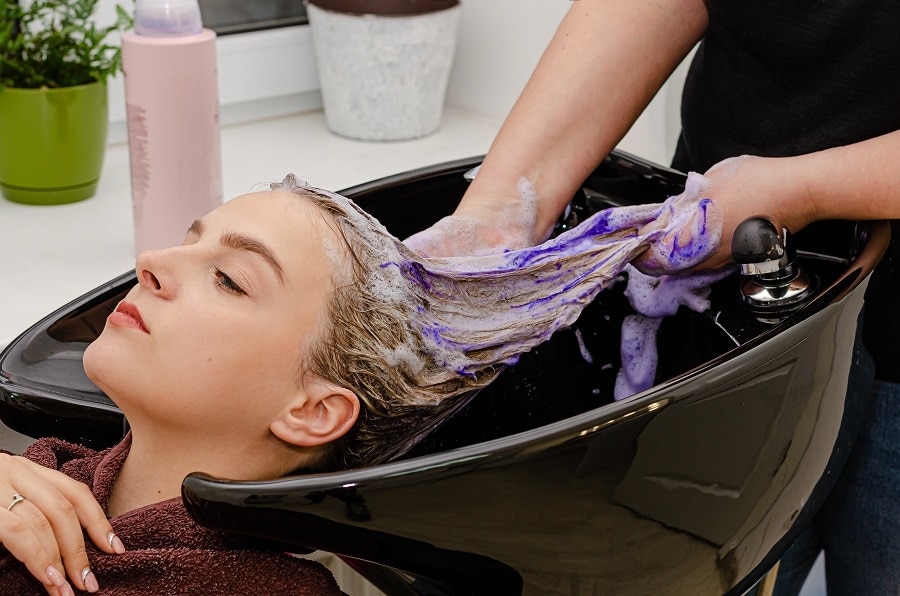 using purple shampoo to fix orange roots