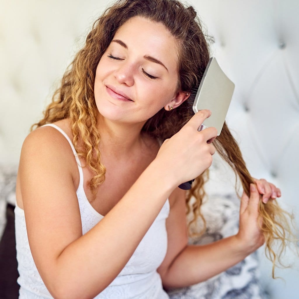 is brushing hair after a perm bad?