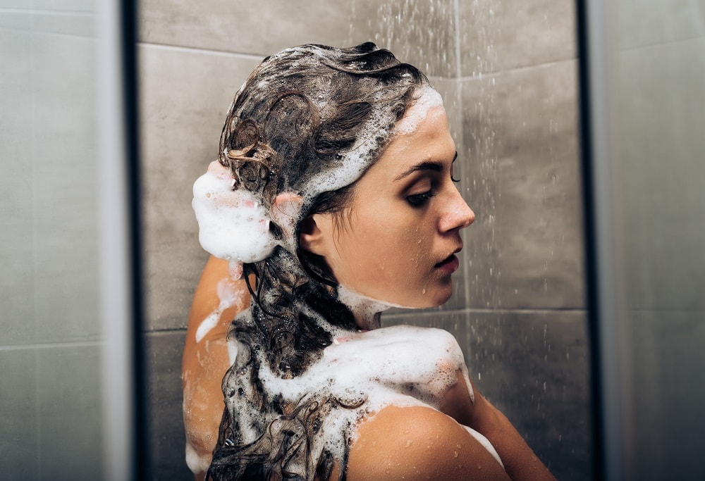 use shampoo to wash away hair spray