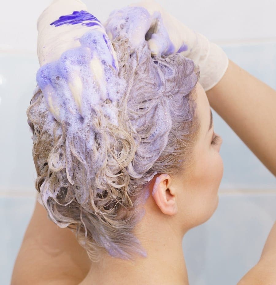 using color deposit shampoo to refresh color treated hair